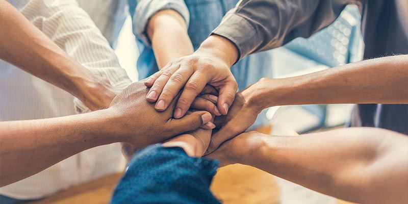 Group of hands stacked together